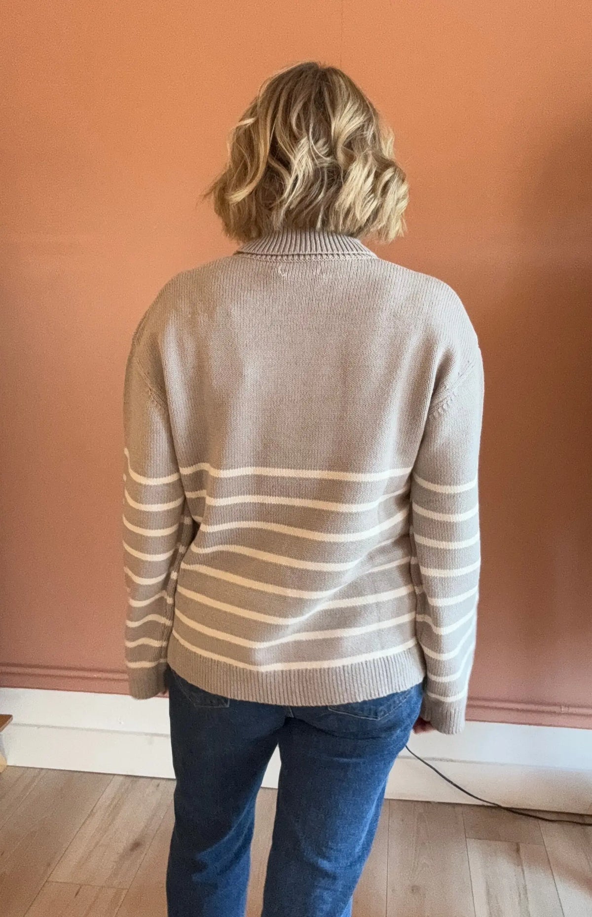 Nude Lucy Venus turtleneck sweater in an extra small size, featuring a cozy knit design and fitted silhouette.