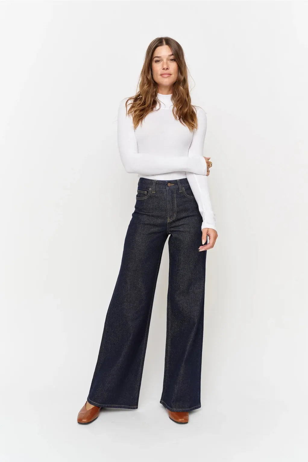 Oliver Logan wide-leg denim jeans featuring a classic fit and light wash, displayed laid flat on a white background.
