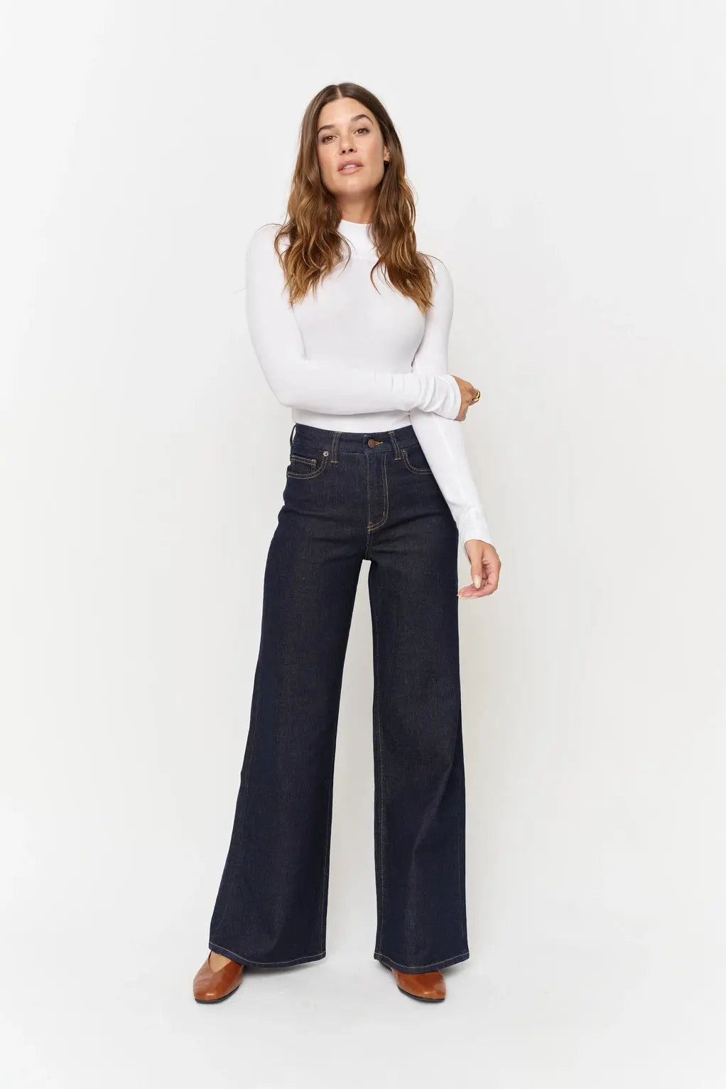 Oliver Logan wide-leg denim jeans featuring a classic fit and light wash, displayed on a neutral background.
