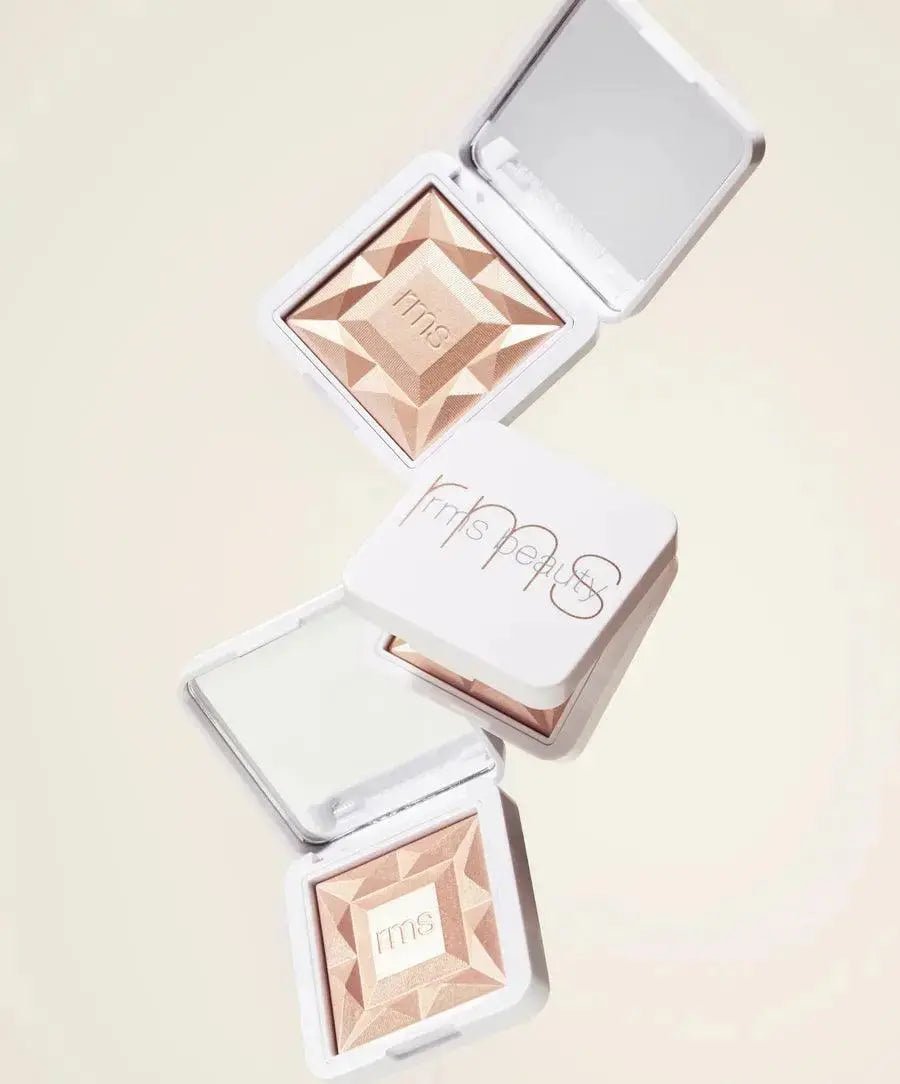 RMS Beauty ReDimension Hydra Dew Luminizer in Prosecco Fizz, a radiant cosmetic highlighter with a luminous glow.