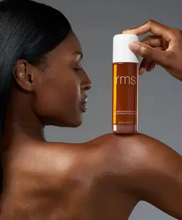 RMS Beauty Kakadu Beauty Body Oil bottle with dropper, showcasing the nourishing skincare product in a sleek glass container.