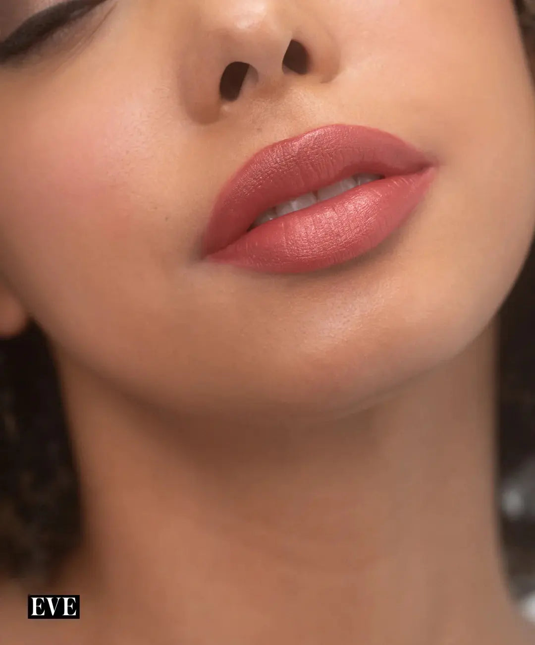 RMS Beauty Legendary Serum Lipstick in Nudes, close-up of dark model's lips showcasing the natural nude lipstick shade.