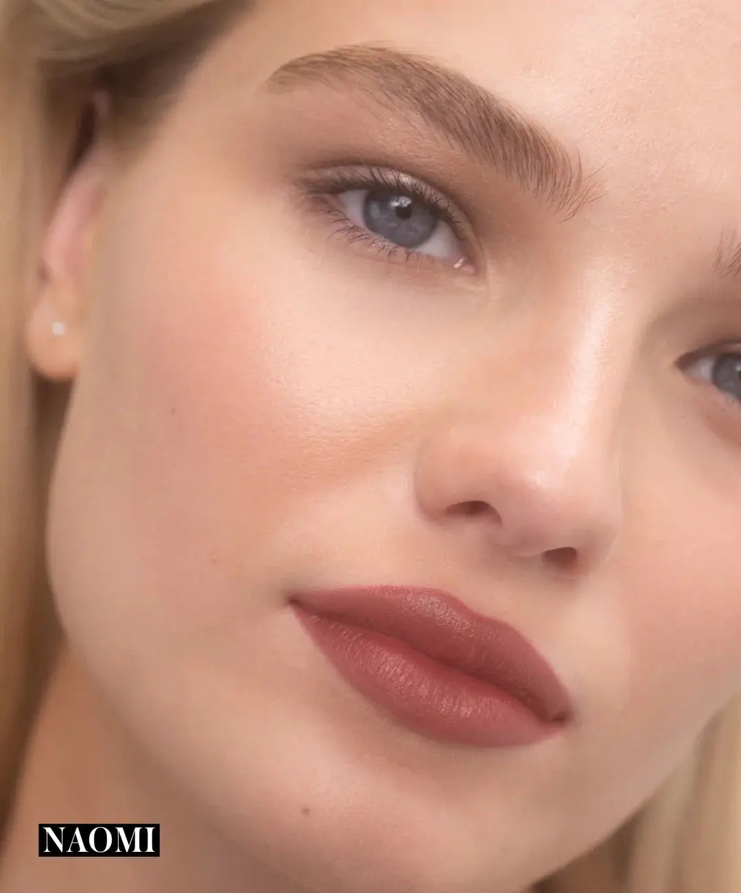 RMS Beauty Legendary Serum Lipstick in Nudes, showing a sleek lipstick tube and a model with nude lips for a natural look.