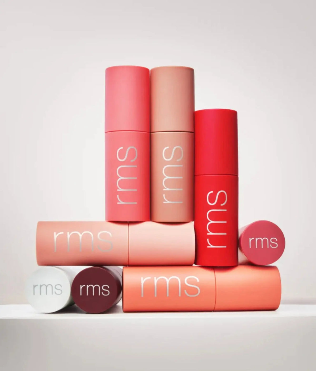 RMS Beauty Legendary Lip Oil in a clear tube with a doe-foot applicator, featuring a glossy, nourishing lip treatment.