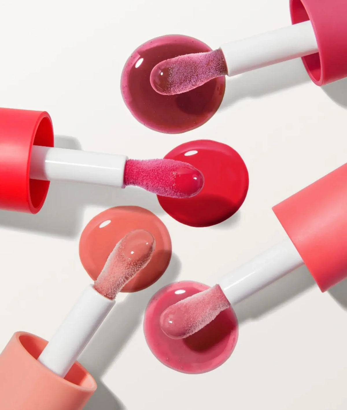RMS Beauty Legendary Lip Oil in a clear glass bottle with a doe-foot applicator, glossy finish and natural ingredients visible.