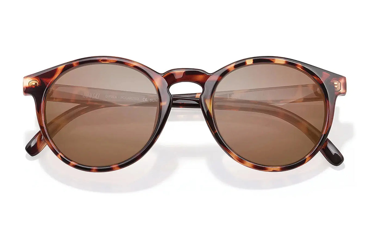 Sunski Dipsea tortoise amber sunglasses with rounded frames and brown-tinted lenses, stylish and protective for outdoor wear.
