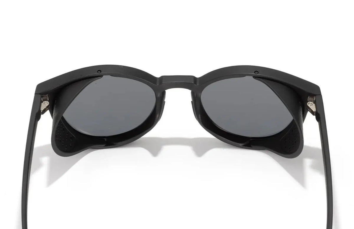 Sunski Tera sunglasses in black and gold with sleek frame and tinted lenses, stylish eyewear for sun protection.