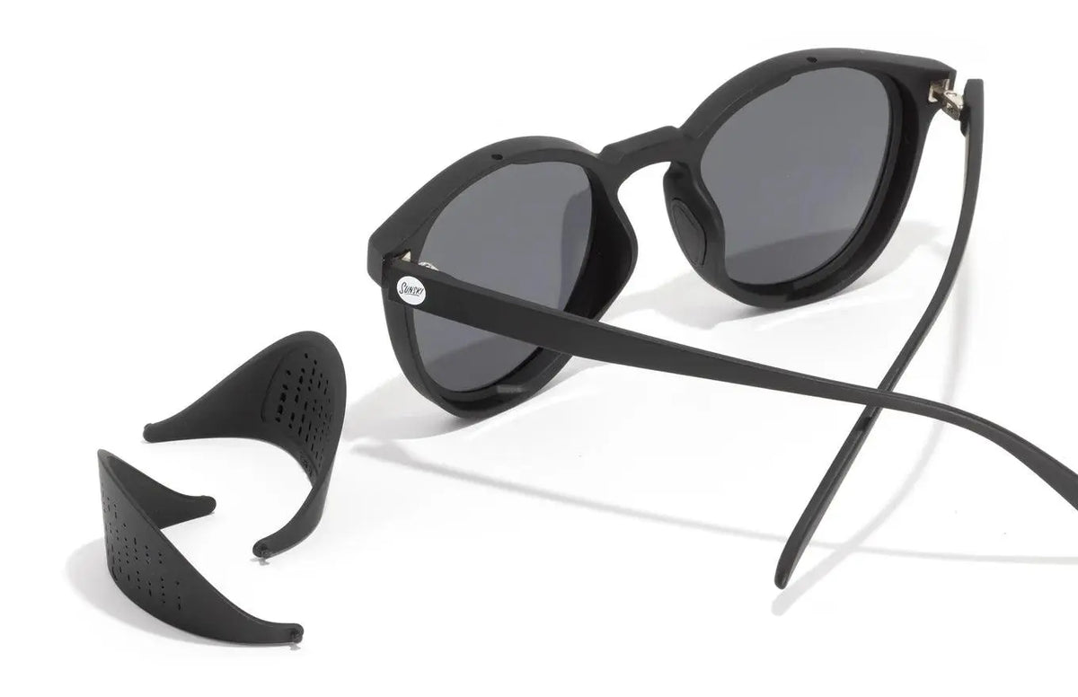 Sunski Tera sunglasses in black and gold with round frames and tinted lenses, stylish and protective eyewear.
