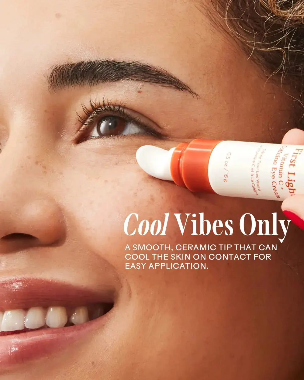 Three Ships First Light Vitamin C + Caffeine Eye Cream jar with bright orange packaging and applicator tip visible.