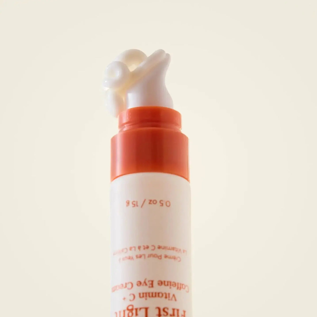First Light Vitamin C and Caffeine Eye Cream by Three Ships, showing the 30ml tube with bright orange and white packaging.