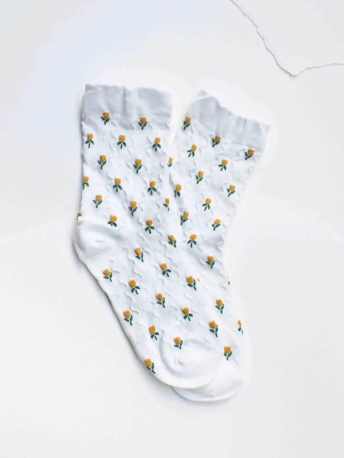 Ivory Tiepology Mini Tulip Flower Socks featuring delicate tulip patterns and soft fabric for comfortable wear.