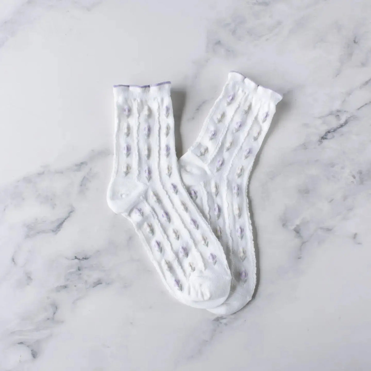 Ivory spring floral socks by Tiepology featuring colorful flower patterns on soft, comfortable sock material.
