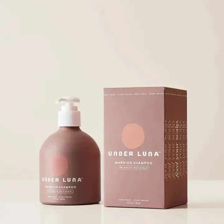 Under Luna Warrior Shampoo bottle with scalp restore and revitalizing hair benefits, 2 oz size, natural hair care product.