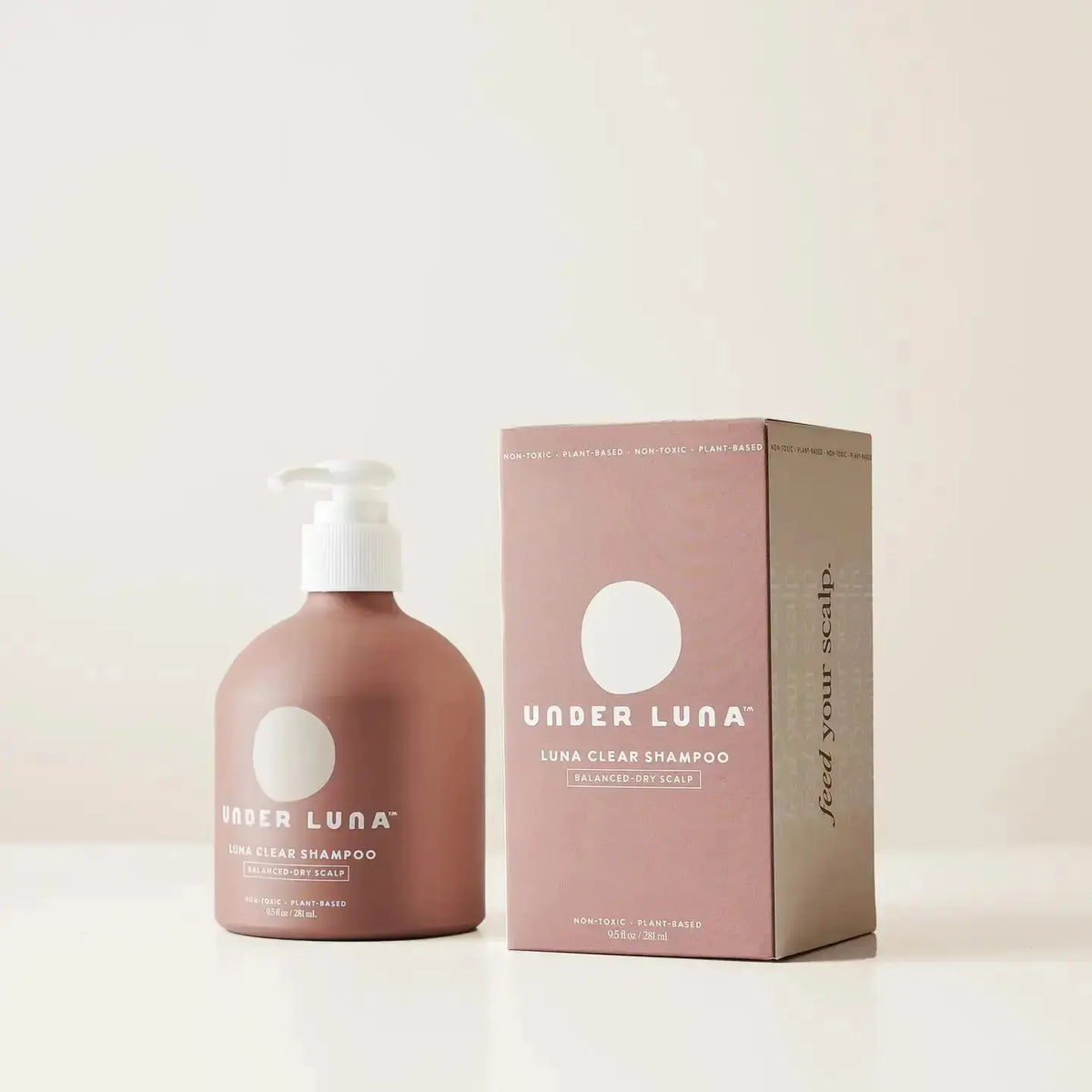Under Luna Luna Clear Shampoo bottle, 2oz size, with clear liquid and label visible, designed for scalp and hair cleansing.