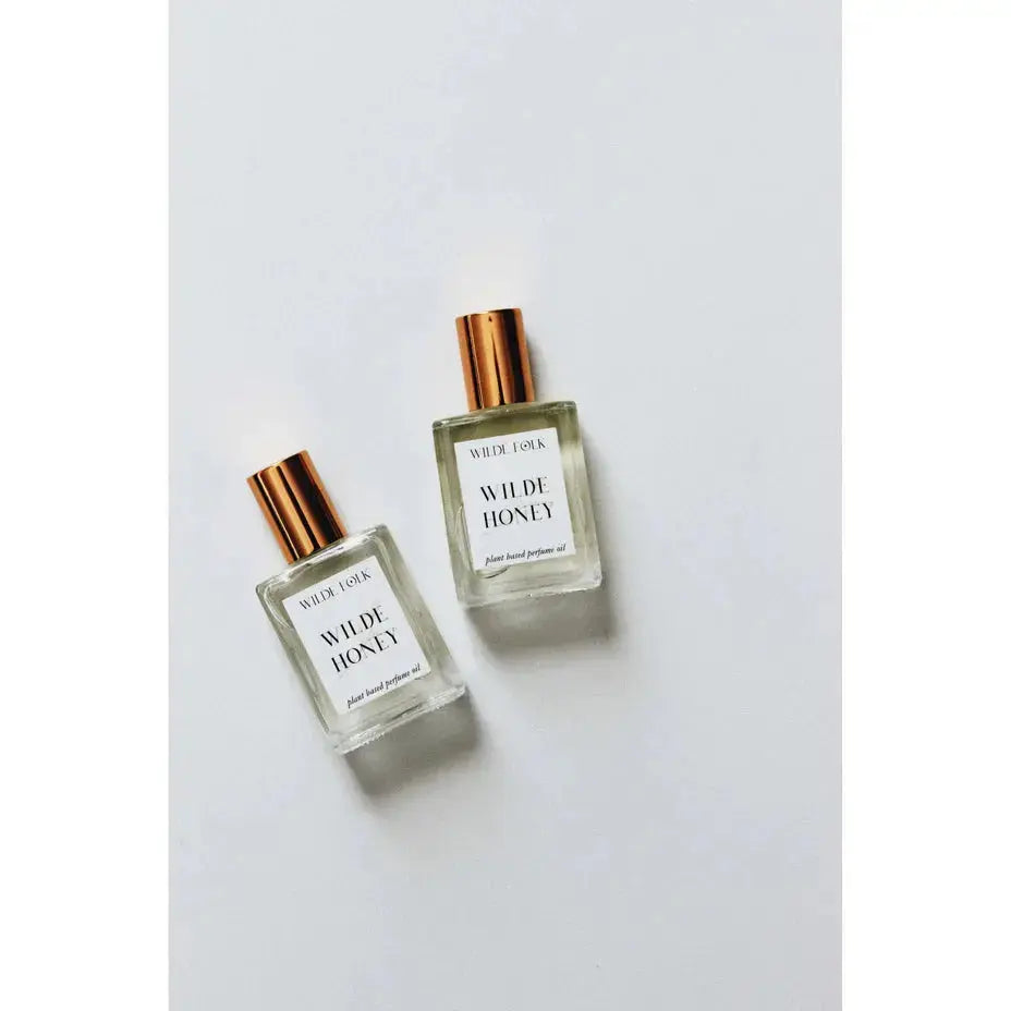 Wilde Honey perfume bottle by Wilde Folk, featuring a sleek design and warm honey scent, on a neutral background.