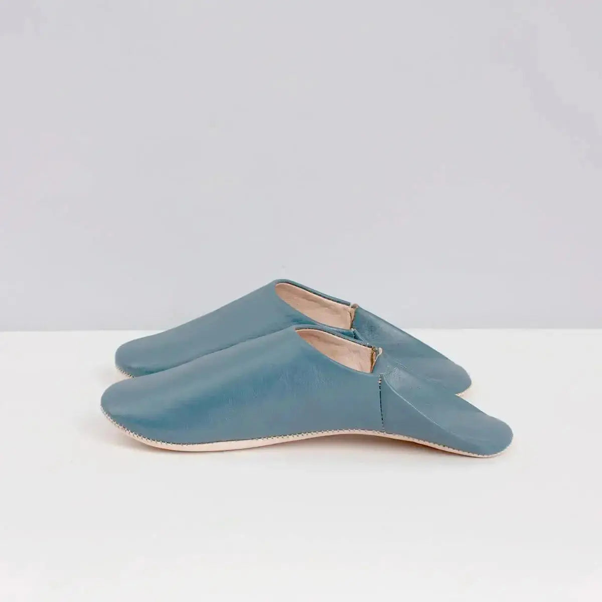 Solid Moroccan leather slippers by Bohemia Design, featuring chalk-colored, soft, handcrafted slip-on slippers with traditional design.