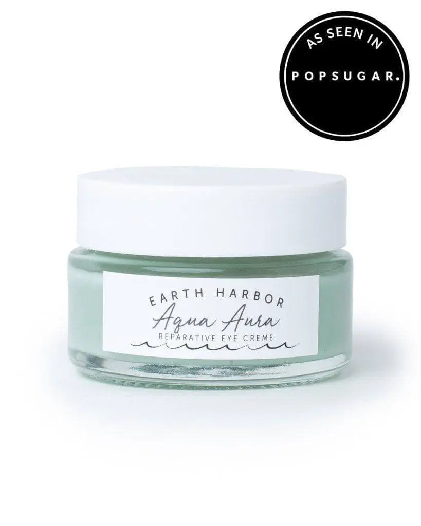 Earth Harbor Aqua Aura Awakening Eye Cream in a sleek jar, designed to refresh and hydrate the delicate skin around the eyes.