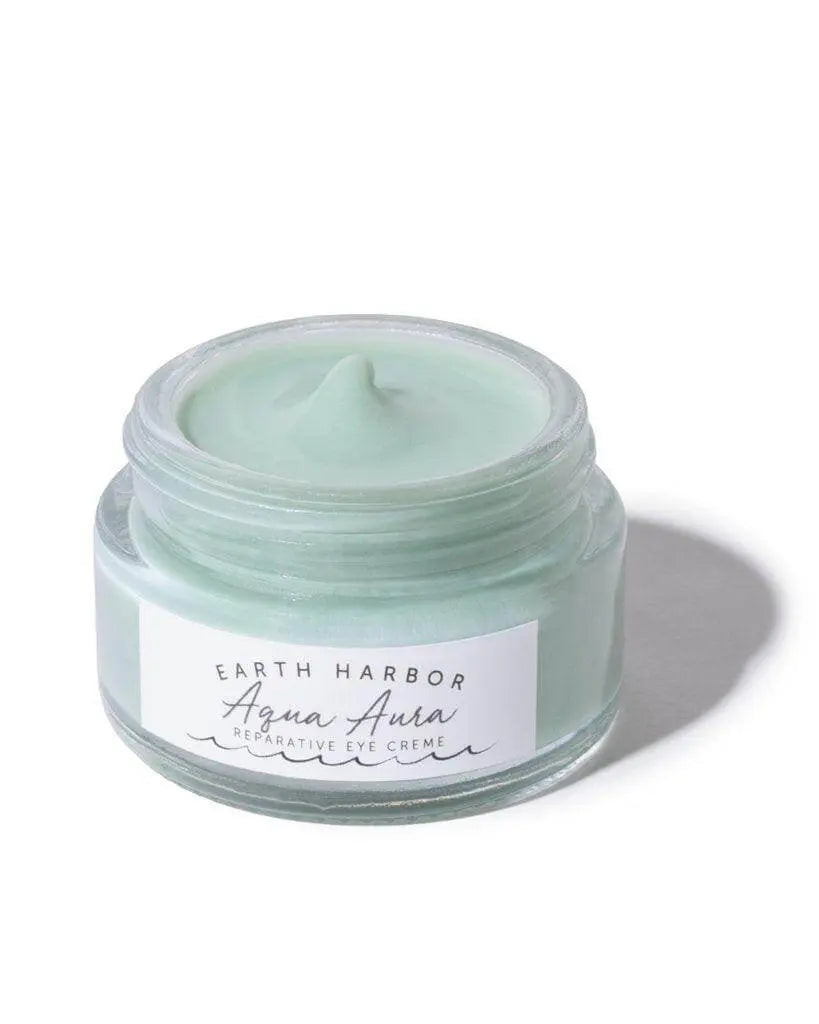 Earth Harbor Aqua Aura Awakening Eye Cream in a sleek jar, designed to refresh and hydrate the delicate skin around the eyes.
