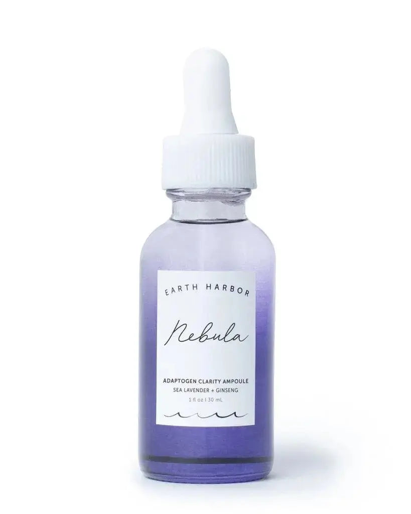 Earth Harbor Nebula Adaptogen Clarity Ampoule for skincare, featuring a sleek glass bottle with a dropper applicator.