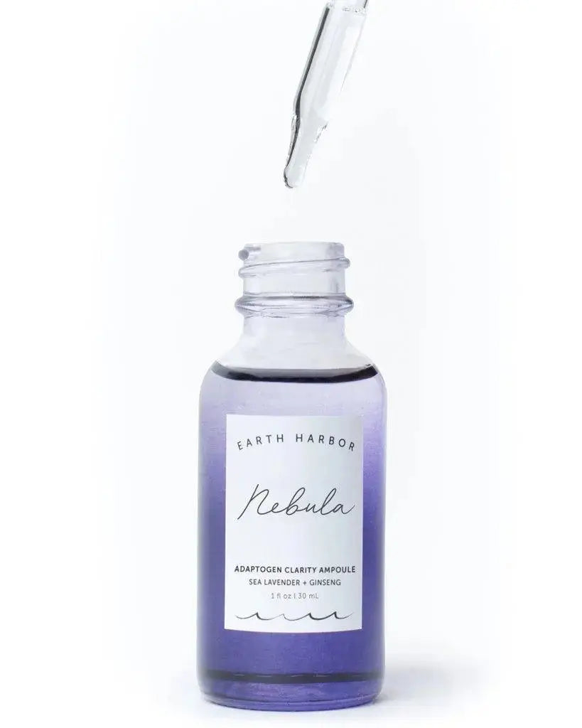 Earth Harbor Nebula Adaptogen Clarity Ampoule in a glass bottle with dropper, part of Earth Harbor's skincare line.