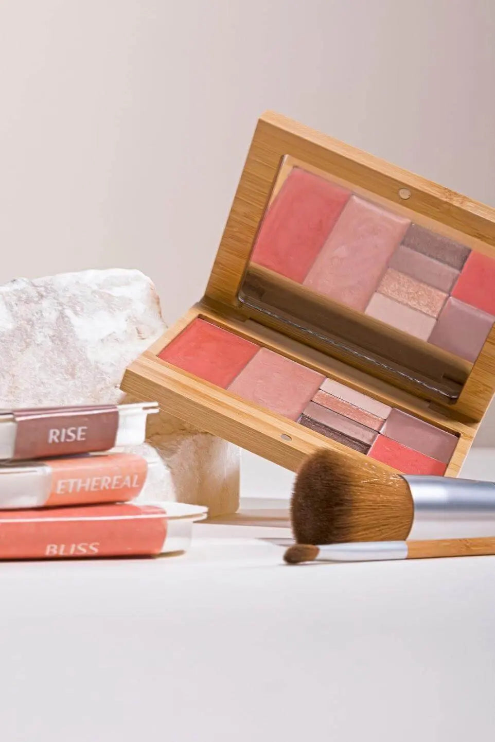 Refillable Capsule Palette by Elate Cosmetics featuring customizable makeup cases and colorful compact compartments.