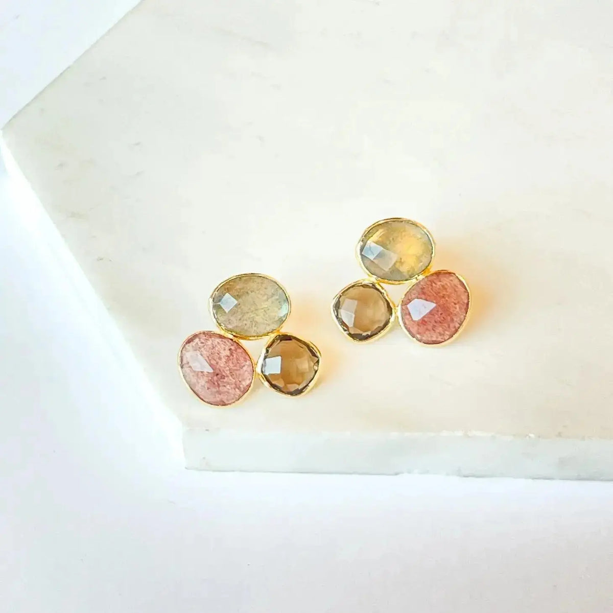 Joya Rosie stud earrings featuring small, elegant metallic studs for a simple and stylish accessory.