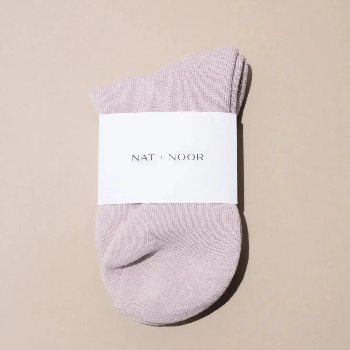 Nat + Noor ankle socks in bone color featuring a soft, comfortable knit fabric and a stylish, minimal design.