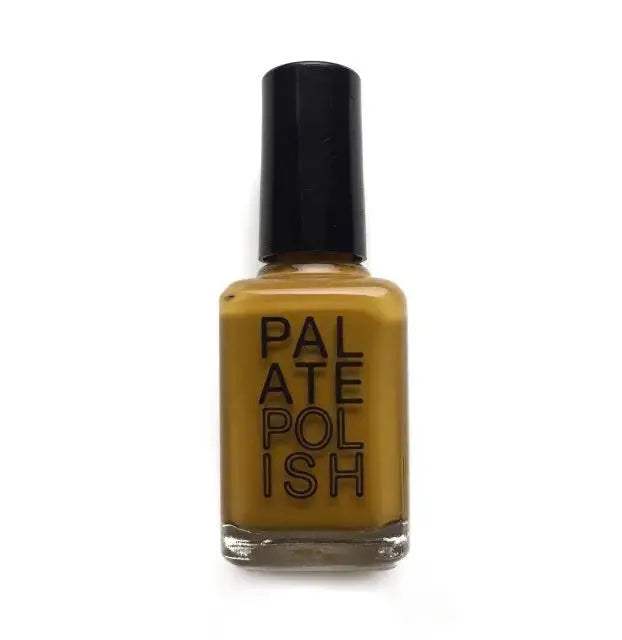 Bright turmeric-colored Palate Polish nail polish bottle with a smooth, shiny finish against a neutral background.