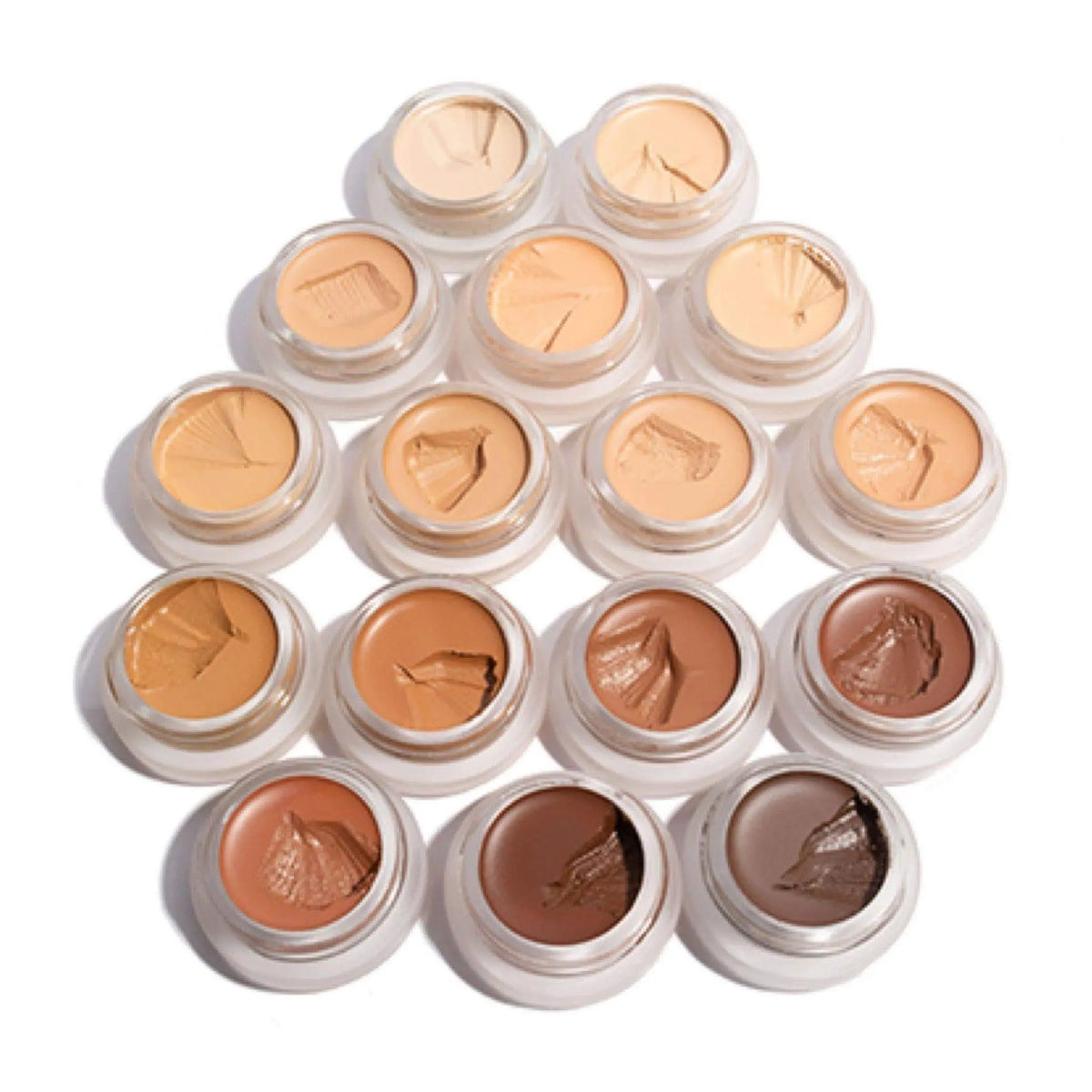 RMS Beauty UnCoverup Concealer in a compact jar, showing creamy beige formula for flawless skin coverage.