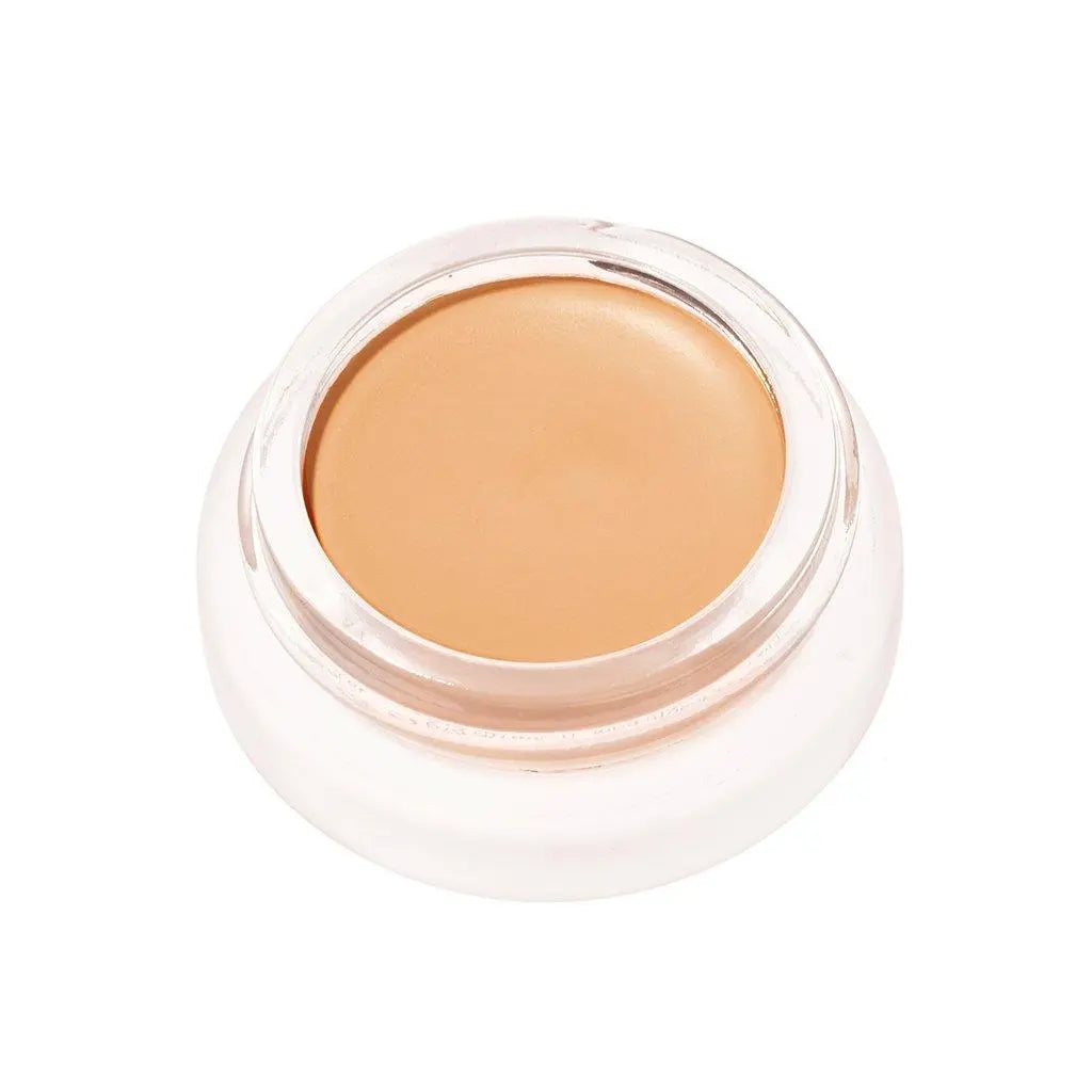 RMS Beauty UnCoverup Concealer in a sleek cosmetic container, showcasing natural skin tone coverage.