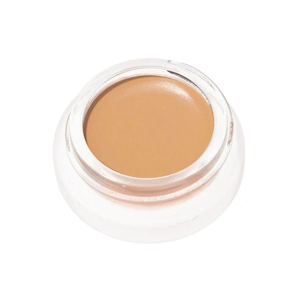 RMS Beauty UnCoverup Concealer in a compact container, showing the creamy beige makeup product for skin imperfection coverage.