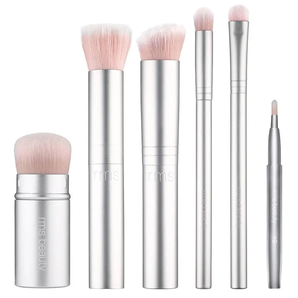 RMS Beauty cosmetics Kabuki makeup brush with soft bristles, ideal for applying powder and blending makeup smoothly.