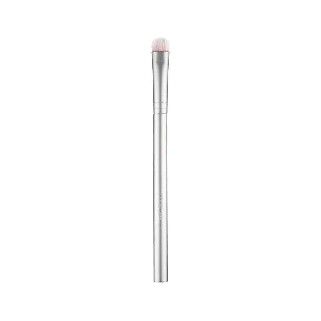 RMS Beauty cosmetics kabuki makeup brush with soft bristles and sleek handle, ideal for applying foundation or powder.