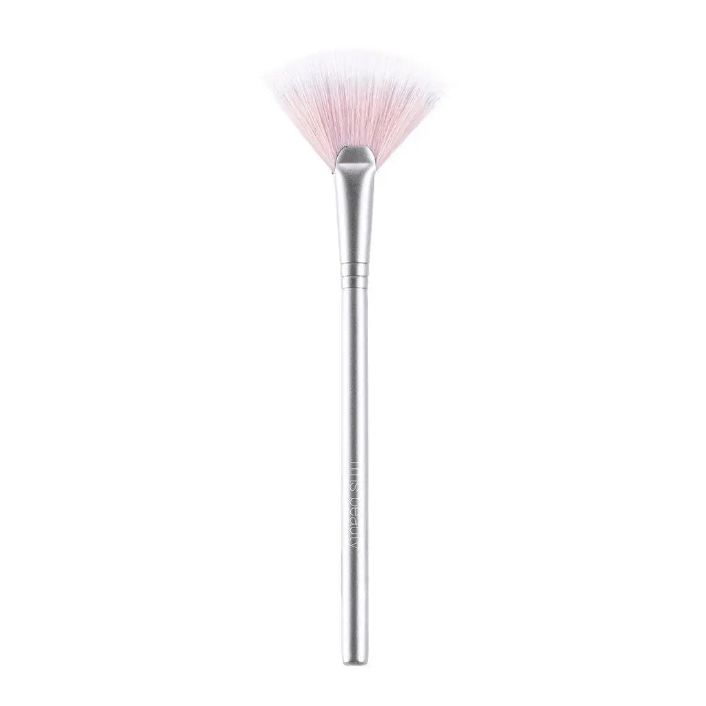 RMS Beauty cosmetics kabuki makeup brush with soft bristles and sleek handle for applying foundation or powder.