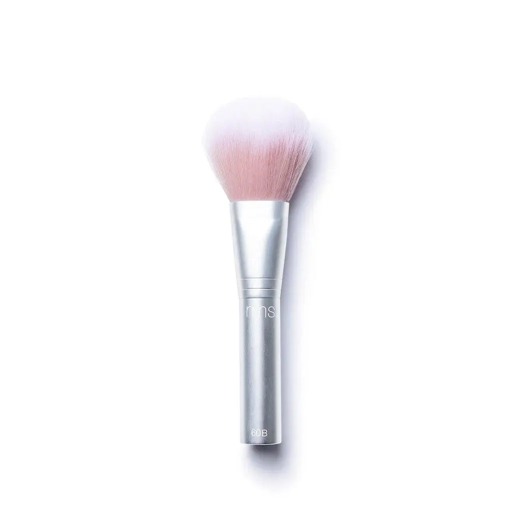 RMS Beauty cosmetics kabuki makeup brush with soft bristles, used for applying powder or foundation.