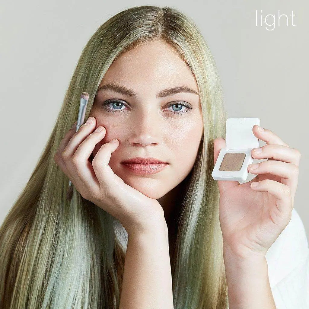 RMS Beauty Back2Brow Powder in light shade, close-up of the compact with product inside for natural eyebrow enhancement.