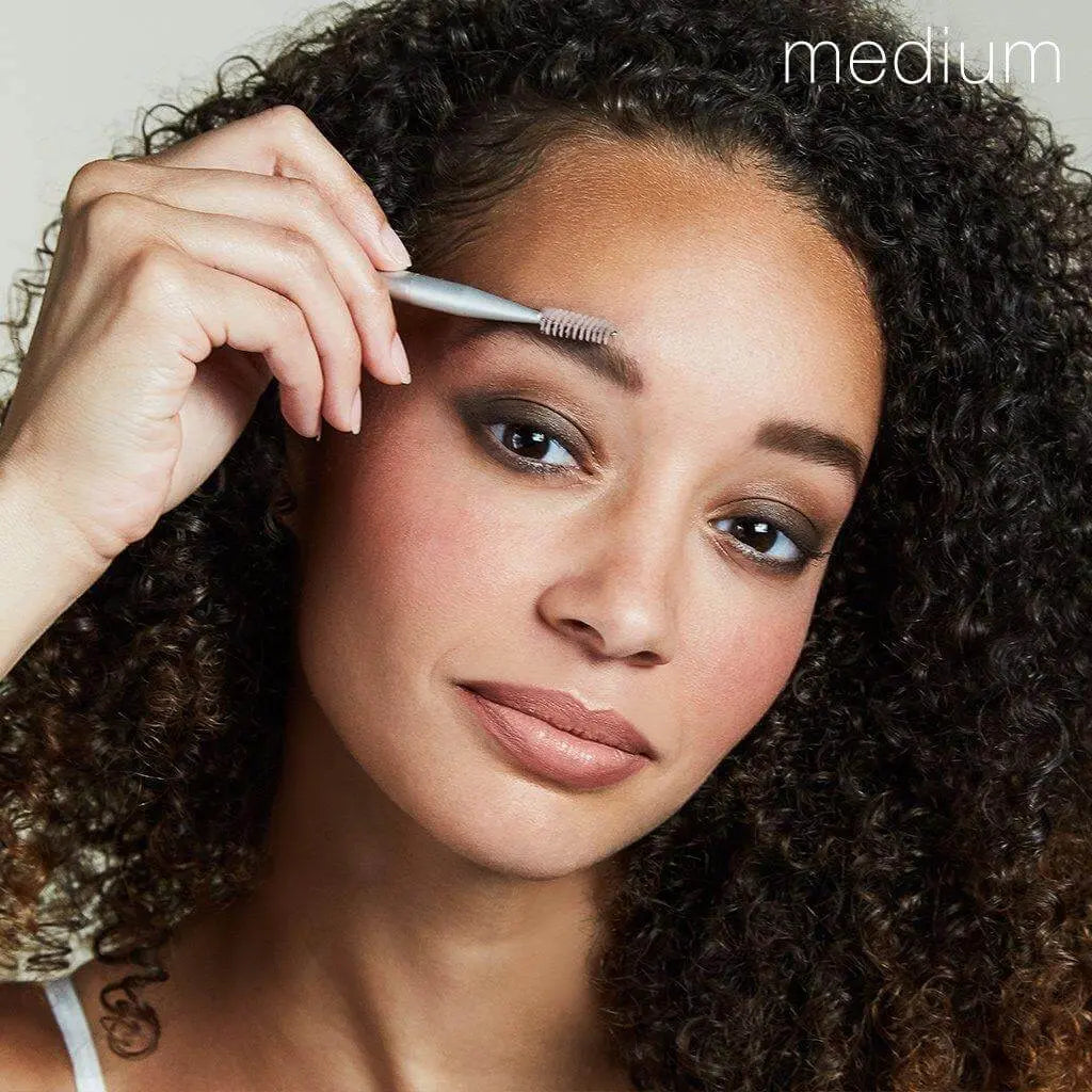 RMS Beauty Back2Brow powder in light shade, a cosmetics product for defining eyebrows, shown in a close-up image.
