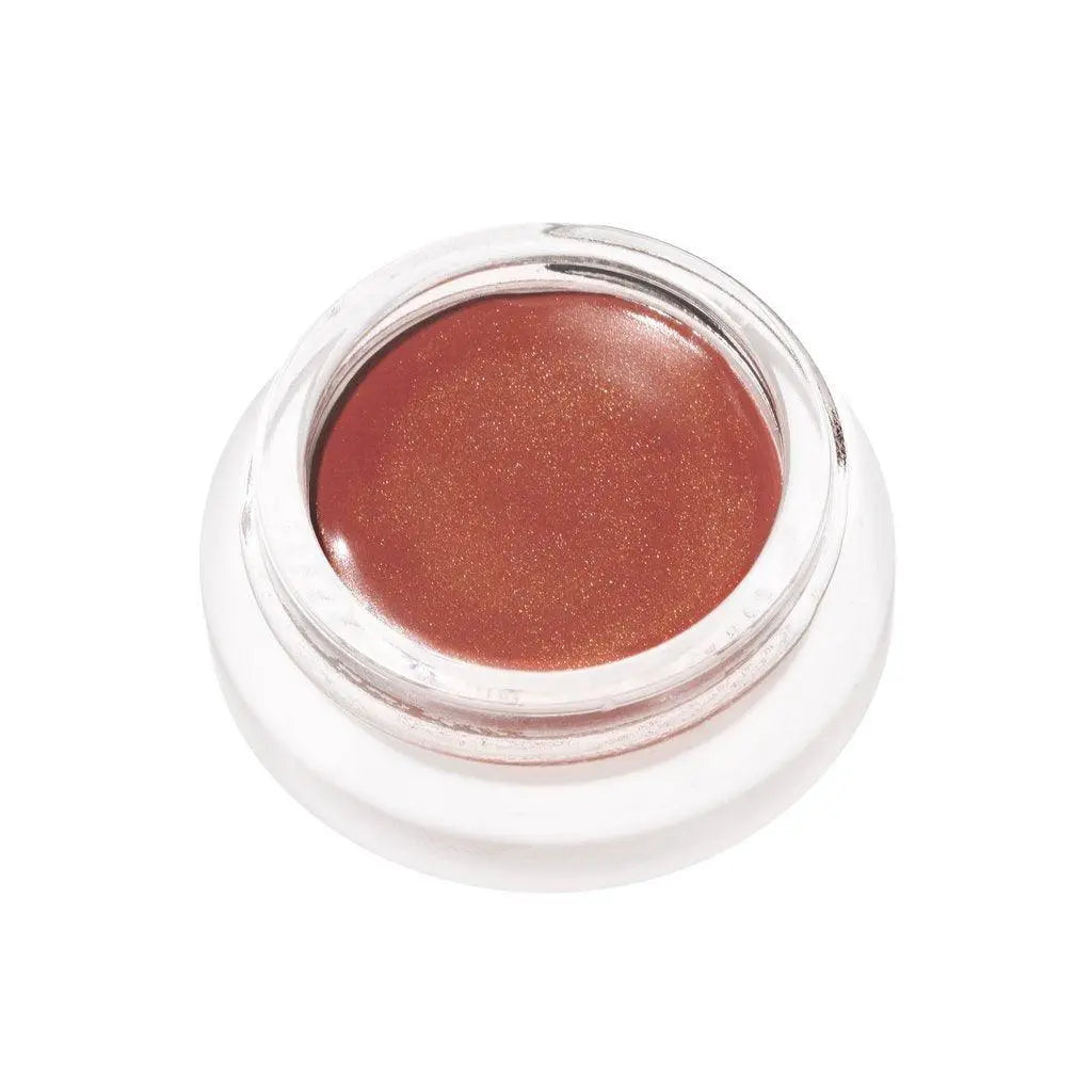 RMS Beauty Lip to Cheek cosmetics in a compact, natural lipstick and blush product with a sleek packaging design.