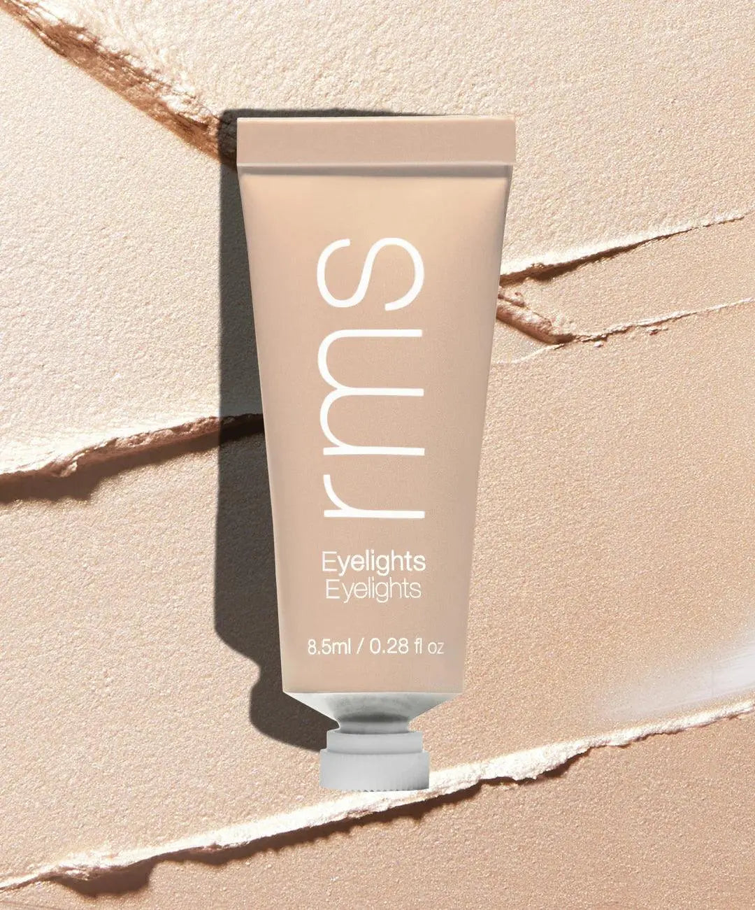 RMS Beauty Eyelights Cream Eyeshadow in Flare, creamy eye shadow with shimmering finish, applied on eyelids for a luminous look.