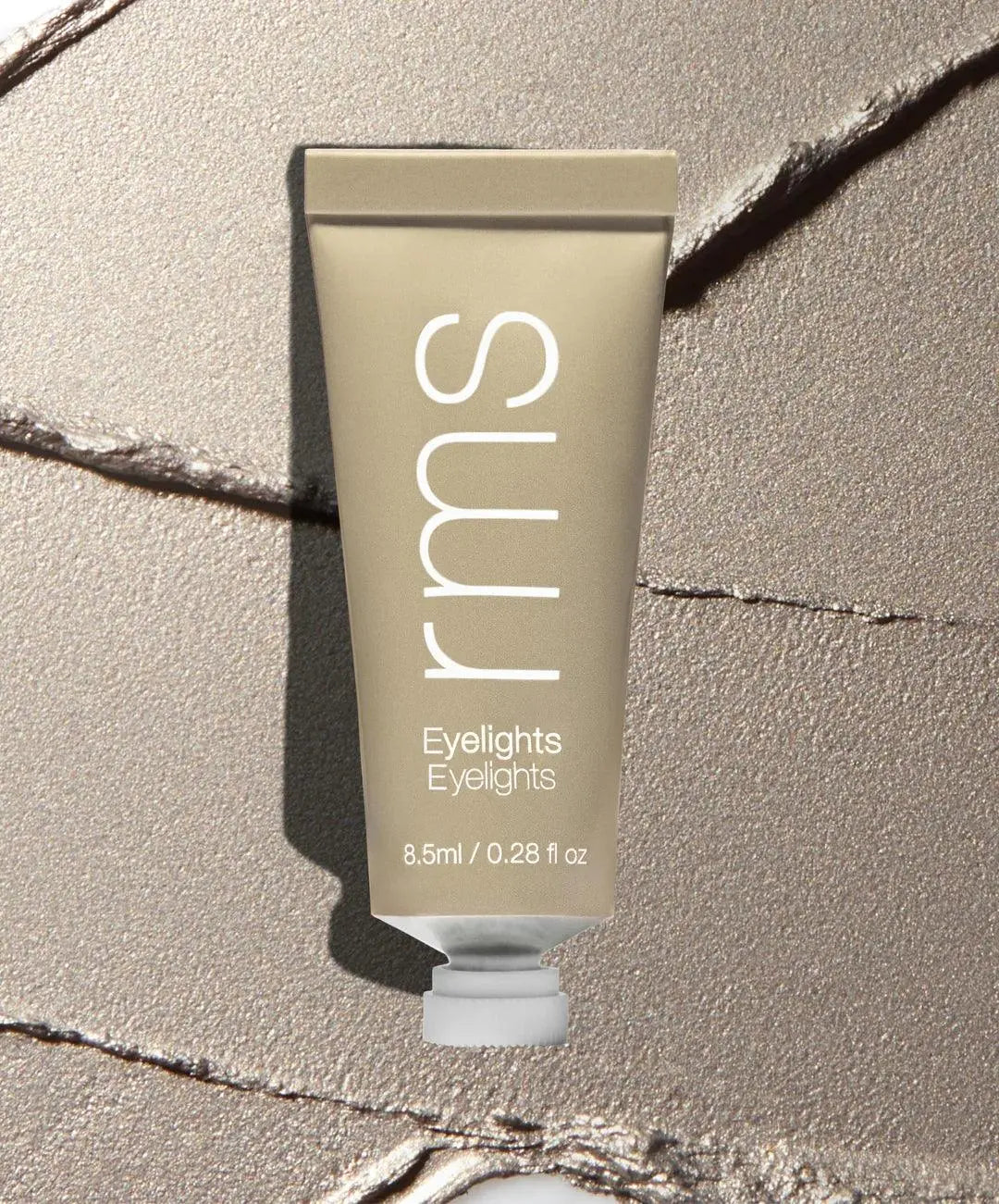 RMS Beauty Eyelights Cream Eyeshadow in Flare, a creamy eye shadow with shimmering finish, applied on eyelids.