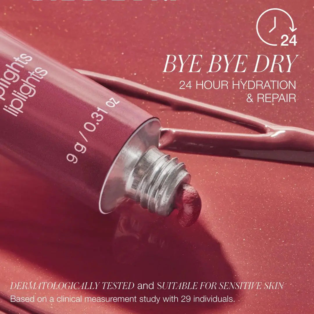 RMS Beauty Liplights Cream Lip Gloss in a natural nude shade, showcasing the smooth, glossy finish on the lipstick tube.